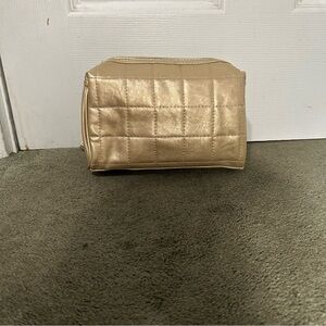Gold and clear makeup bag set.